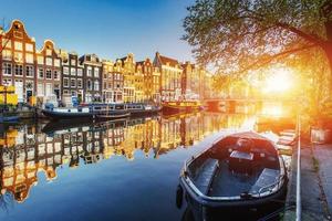 Amsterdam canal at sunset.  is the capital