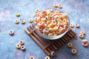 close up of colorful cereal corn flakes in a bowl photo