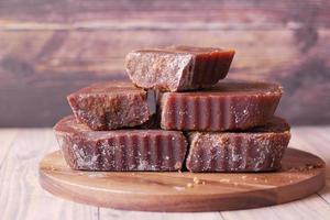stack of Jaggery traditional cane sugar cube on table photo