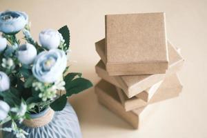 close up of crafter gift box and flower on table photo