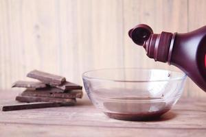 dark chocolate cream in a bowl on white photo