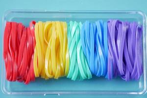 rainbow color Rubber bands on color background photo
