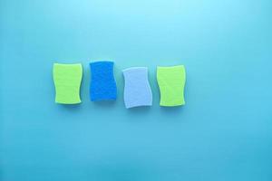 stack of sponge on blue background with copy space photo