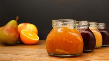 Home-made jam, selective focus. Jars with marmalade, confiture. Sweet dessert photo