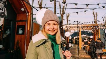 Young blonde at the European street food fair. She is happy photo