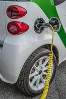 Electric car while charging the energy battery photo