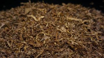 Pile of tobacco on  black background photo