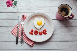 fried egg with ketchup and cheese brie. Tasty fragrant morning coffee photo