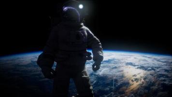 Astronaut in outer space against the backdrop of the planet earth video