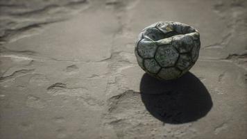 Old soccer ball the cement floor video