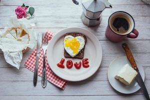 fried egg with ketchup and cheese brie. Tasty fragrant morning coffee photo