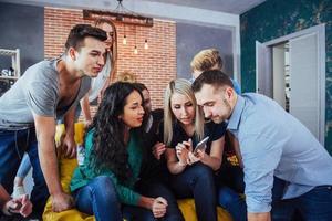 Group portrait of Cheerful old friends communicate with each other, friend posing on cafe, Urban style people having fun, Concepts about youth togetherness lifestyle. Wifi connected photo