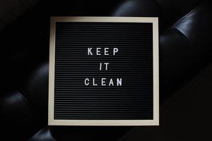 KEEP IT CLEAN letter board quote on black background photo