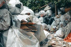 Messy pile of garbage bags photo