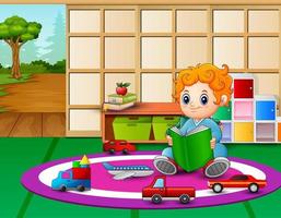 A little boy reading book in classroom vector