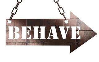 behave word on metal pointer photo