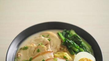 Ramen noodles in pork bone soup with roast pork and egg or Tonkotsu ramen noodles - Japanese food style video