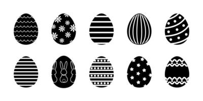 Vector Easter eggs glyph collection. Set of black rubber stapms with decorated eggs