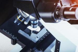 Close up of microscope at the laboratory. photo