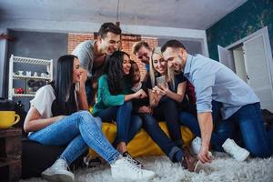 Group portrait of Cheerful old friends communicate with each other, friend posing on cafe, Urban style people having fun, Concepts about youth togetherness lifestyle. Wifi connected photo