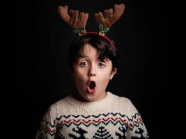 surprised child with wearing reindeer photo