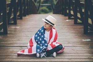 child with the flag of the United States photo