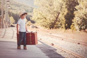 child on train tracks photo