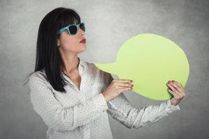 Young Woman holding a speech bubble photo