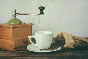 cup of coffee, Coffee grinder and coffee beans photo