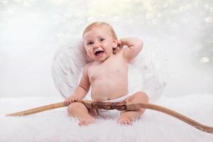 Baby dressed as an angel photo