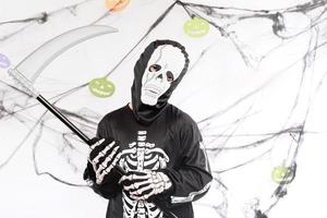 Happy Halloween. Funny child disguised as skeleton photo