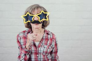 funny grandmother with sunglasses and mustache photo