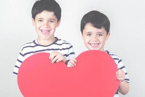 happy children with a red heart photo