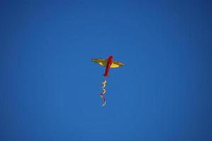 kites rise on blue sky photo