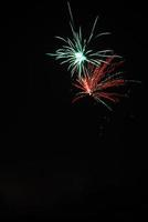 high red and green explosion at a fireworks display on new years eve photo