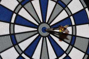 an arrow hit the bullseye in a darts photo