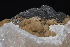 minerals stone found piece of quartz rock with brown balls photo