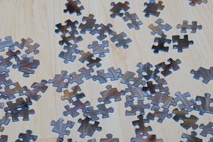 Puzzle pieces colorfully scattered on the floor to play photo
