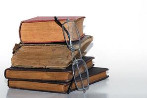 stack books with glasses photo