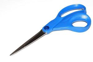 blue scissors on white background photo