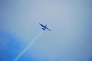blue plane on blue sky photo