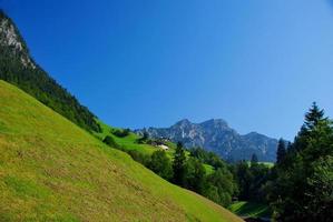 steep mountain with blue sky photo