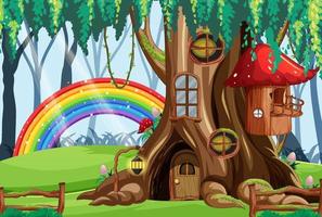 casa del árbol de hadas en el bosque con arco iris vector