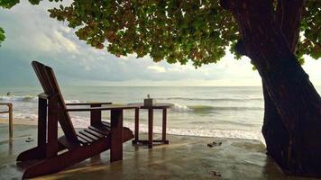 empty wooden chair with beach sea background video