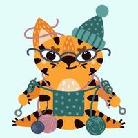 lindo tigre rayado de dibujos animados. ilustración vectorial aislado sobre fondo blanco. el gato con gafas teje. un gatito amable con un sombrero con bolas de lana. estilo plano, estampado infantil. vector