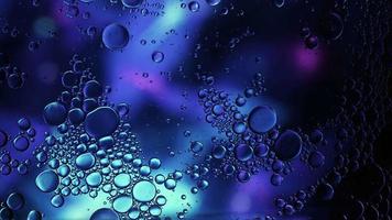 Abstract Colorful Food Oil Drops Bubbles and spheres Flowing on Water Surface, macro Videography video