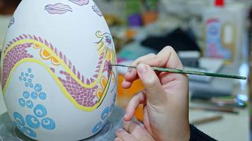 Working in a Ceramic Workshop Drawing and Painting Huge Easter Paschal Egg video