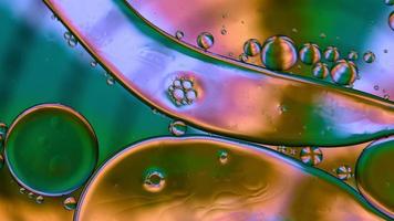 Abstract Colorful Food Oil Drops Bubbles and spheres Flowing on Water Surface, macro Videography video