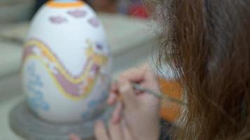 Working in a Ceramic Workshop Drawing and Painting Huge Easter Paschal Egg video