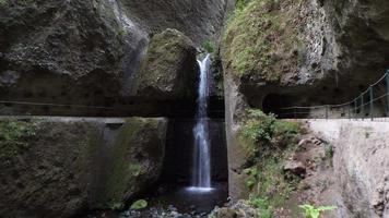 Amazing waterfall deep inside of the mountain. Tunnel, cave passage for hikers. Jungle feeling. Travel the world. Holidays for relaxing times. video